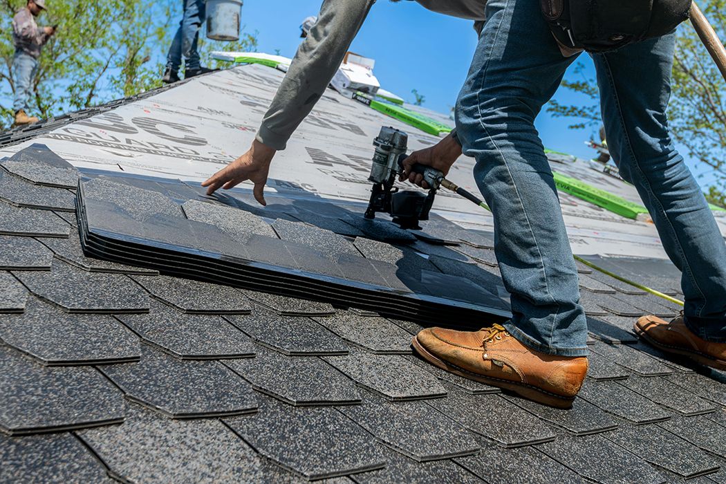 Crew completing a full roof replacement